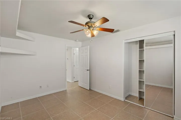 2nd Guest bedroom bedroom with ceiling fan and a closet