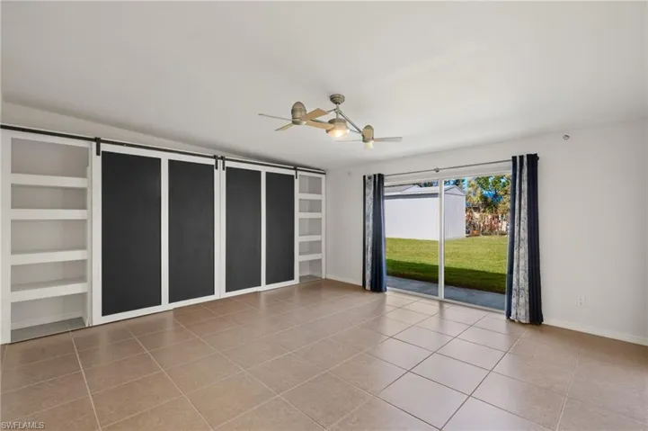 Family room with light tile patterned floors