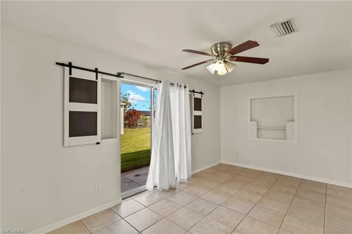 Sliding doors out to back yard from primary bedroom