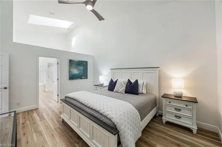 Vaulted ceiling with skylight and ceiling fan
