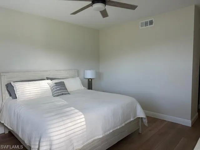 Bedroom featuring wood finished floors and ceiling fan