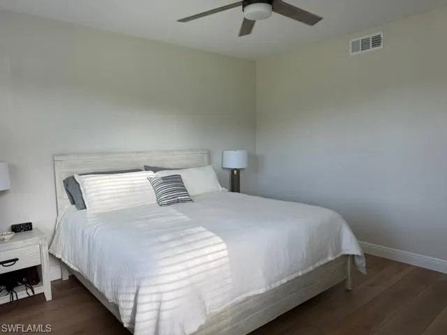 Bedroom with wood finished floors and a ceiling fan