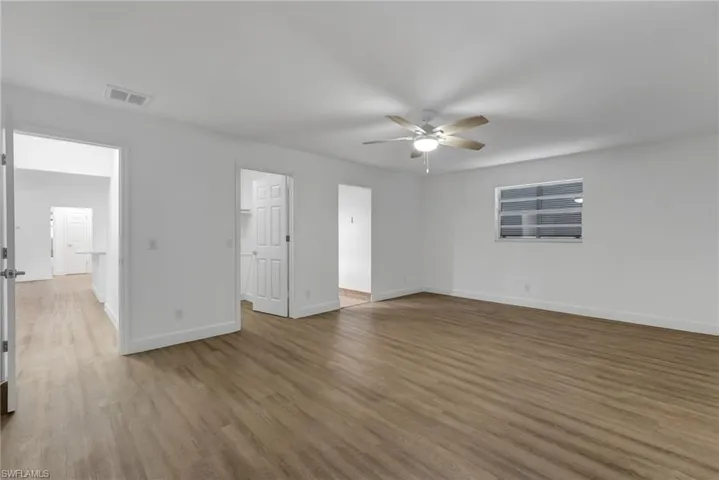 The oversized primary suite features a generous walk-in closet and a private ensuite bath designed for comfort and convenience.