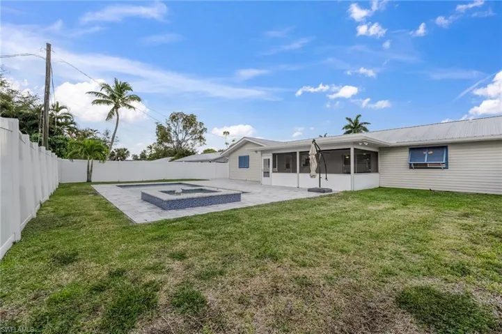 The expansive corner lot boasts an extensive fenced outdoor area, creating a secure and private retreat where children and pets can play freely.