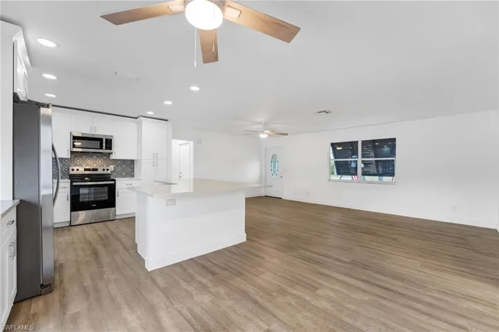The open-concept living area offers a seamless flow, creating the perfect space for entertaining.