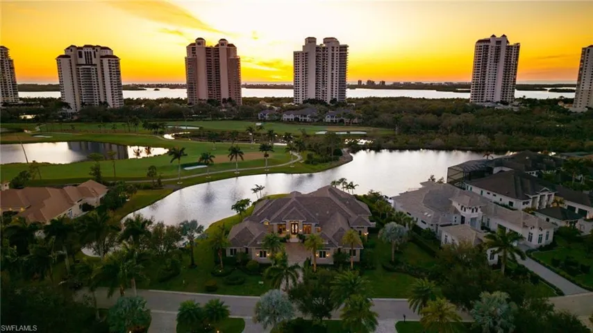 Drone / aerial view of a large body of water and golf course