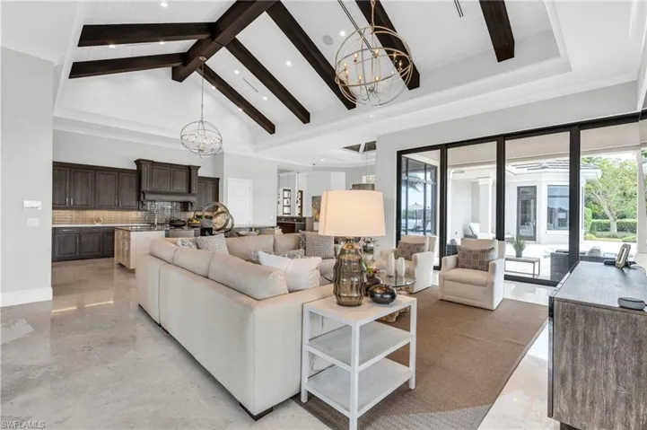 Beamed ceilings and lake views from almost every room in the home