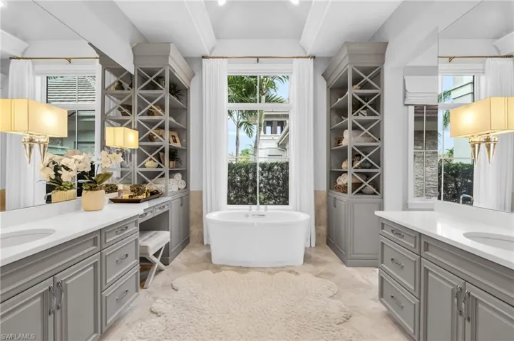 Spa like master bath complete with a walk in shower and a freestanding tub