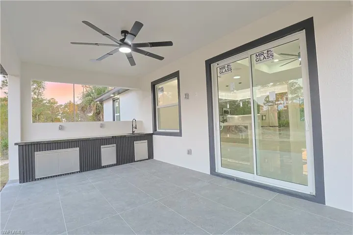 Patio terrace at dusk featuring a ceiling fan and a patio area
