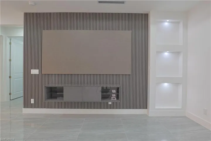Detailed view of an accent wall and baseboards