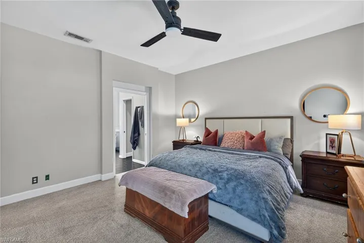 Bedroom featuring ceiling fan and light colored carpet