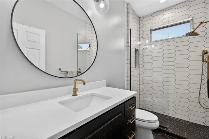 Bathroom with vanity and a shower stall