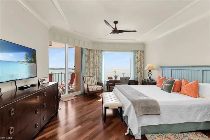 Bedroom with dark wood-style floors, multiple windows, a ceiling fan, access to outside, and crown molding