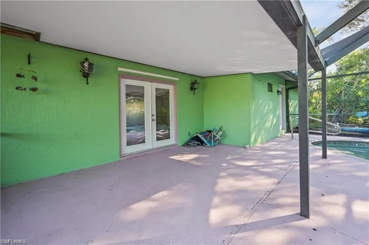 View of patio / terrace featuring a lanai and french doors