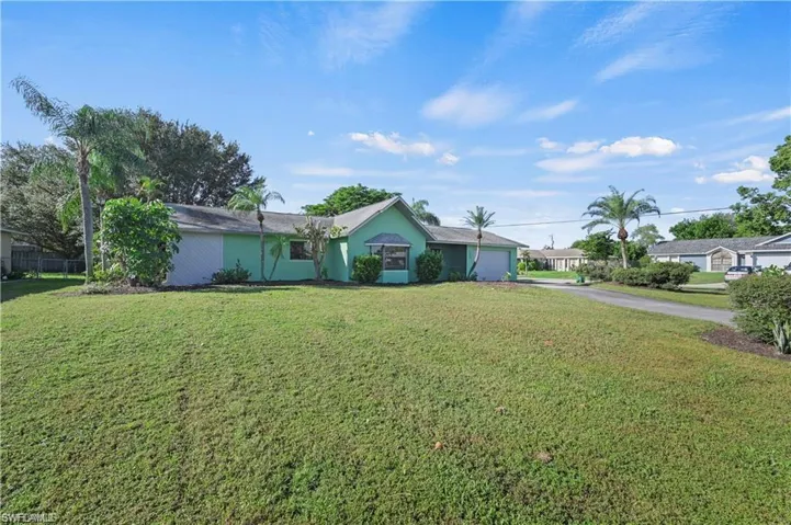Ranch-style home with a front yard