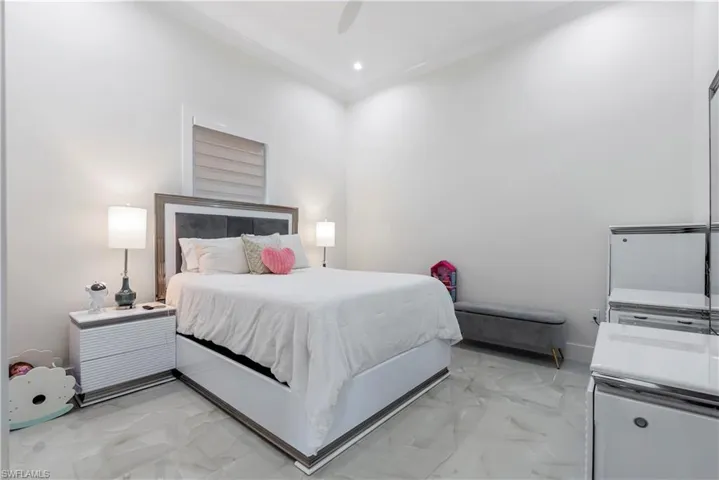 Bedroom with marble finish floor, baseboards, ceiling fan, and recessed lighting