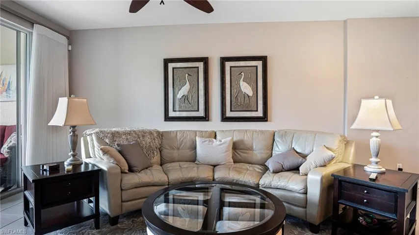 Living room featuring ceiling fan