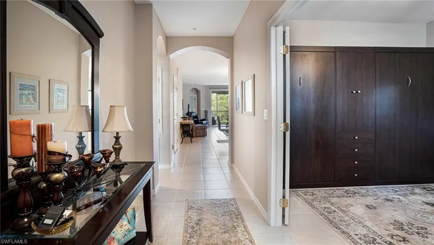 Hallway and murphy bed to the right in the den