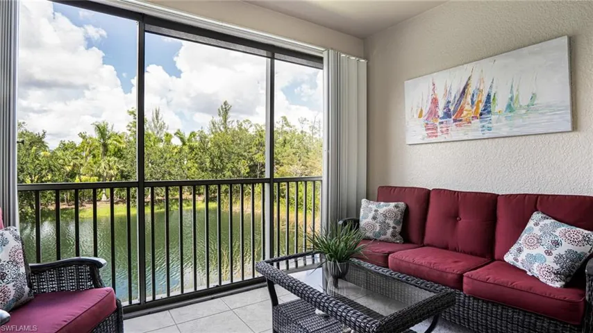 Sunroom with a water view