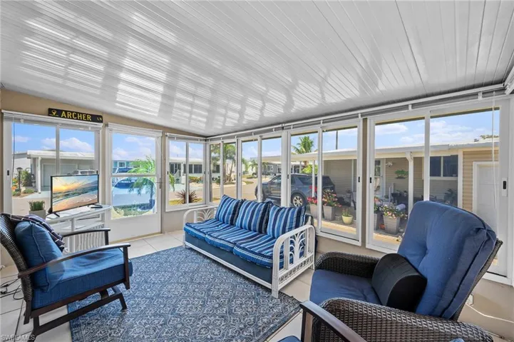 Sunroom with an outdoor hangout area