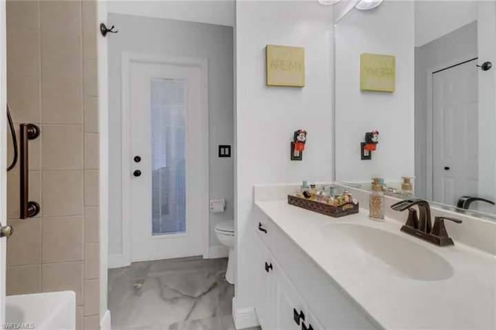 Full bathroom with vanity, independent shower and bath, and toilet