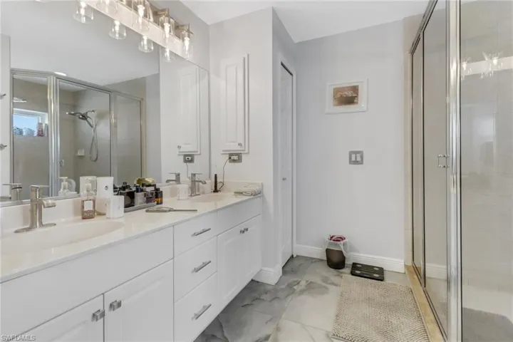 Bathroom with vanity and walk in shower