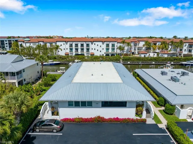 Bird's eye view of  Condo building and Canal in rear.