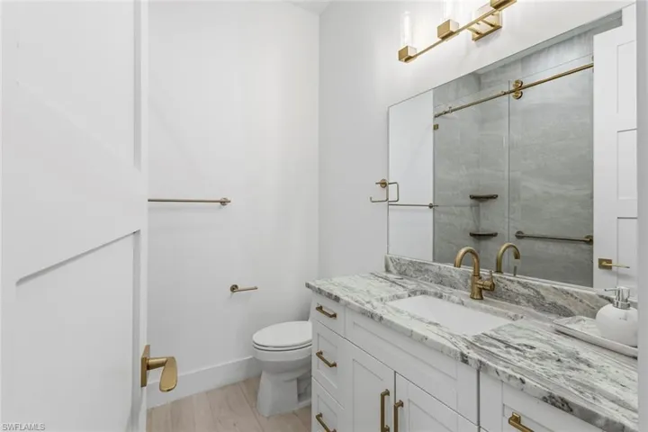 Bathroom featuring vanity and a shower