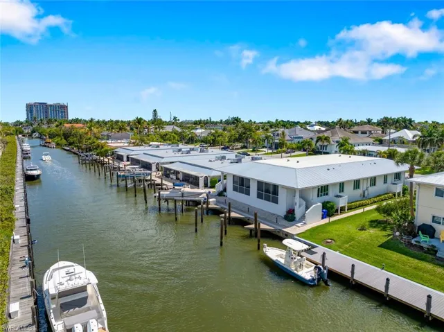 Dock on Canal leads right to Gulf. Rear view of Condo with Boat Slip #1.