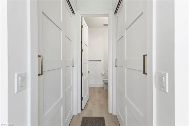 Hallway to Bedrooms and Full Guest Bathroom