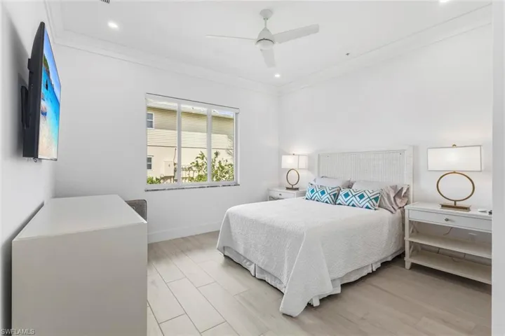 Master Bedroom with Ceramic Tile floors, a ceiling fan, crown molding, and recessed lighting