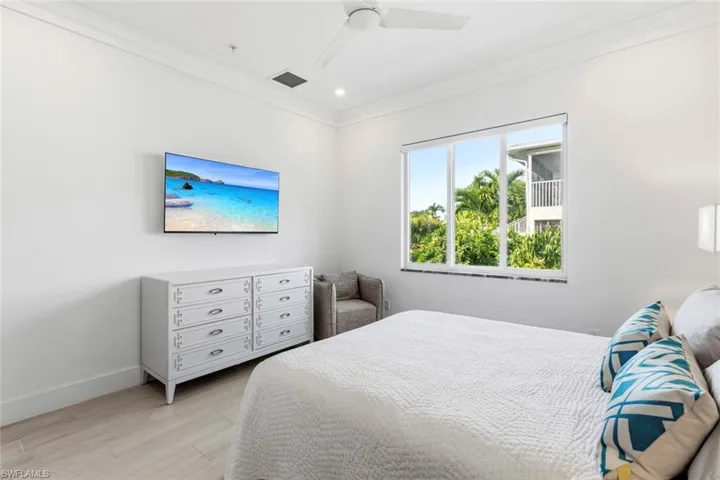 Master Bedroom with ornamental molding, a ceiling fan, light Ceramic Tile floors, and recessed lighting
