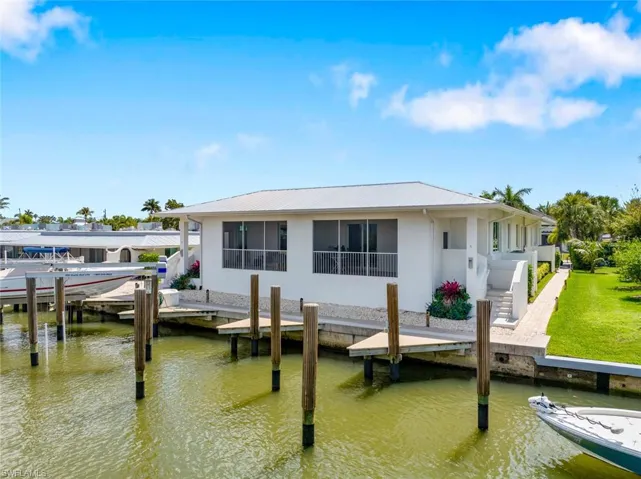 Dock/Slip with beautiful decking Rear view of the Properry. Deeded Slip No 1 with Condo