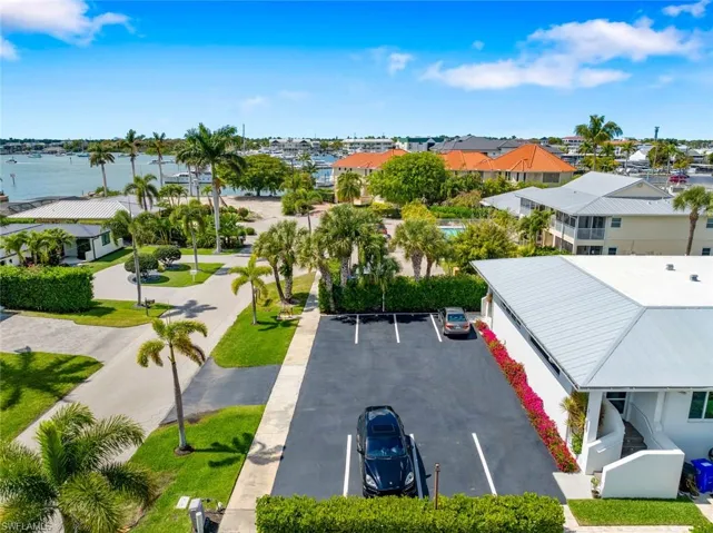Drone / aerial view of Front of Condo and Assigned Parking Spots for the Complex. Each owner has 2 assigned spots.