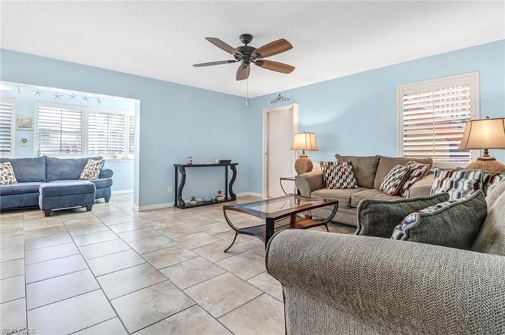 living room open to dining and open den/sunroom