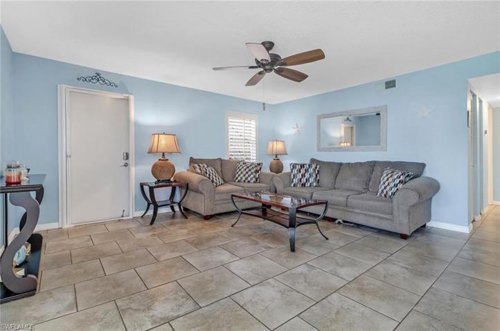 Living room open to dining and den