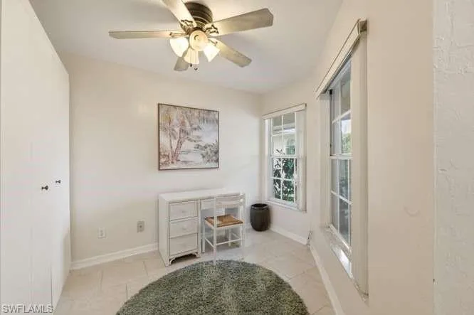 Den with a Murphy bed, with attached powder room