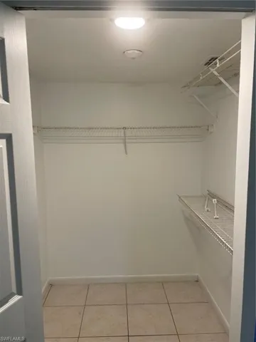 Spacious closet featuring light tile patterned floors