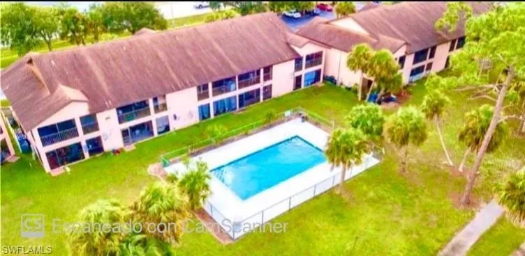 View of swimming pool featuring a yard