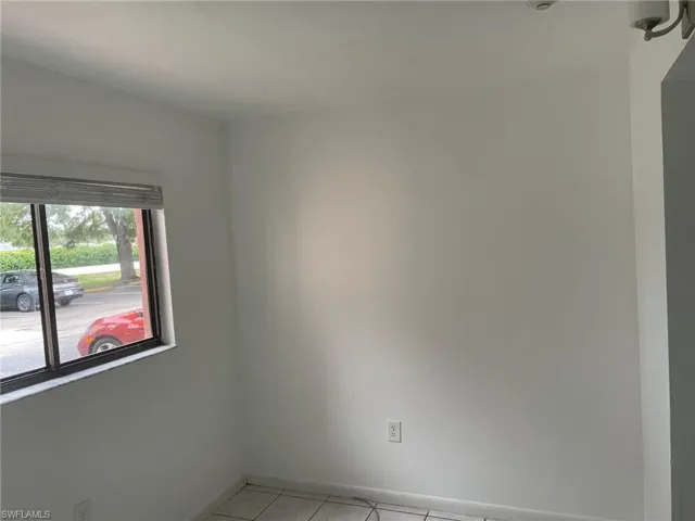 Spare room with light tile patterned floors