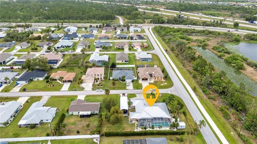 Birds eye view of property featuring a residential view and a water view