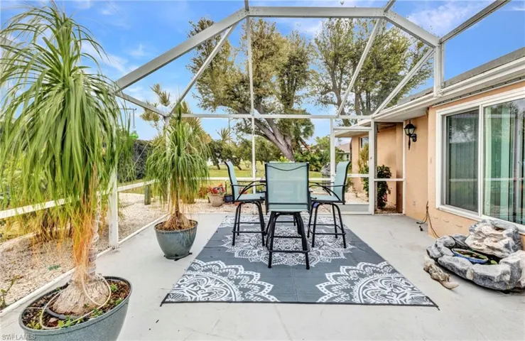 View of patio featuring a lanai and outdoor dining space