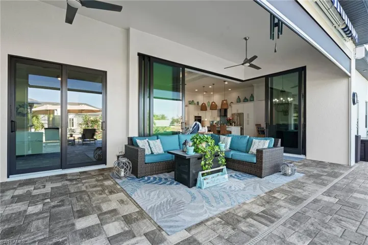View of patio featuring outdoor lounge area and ceiling fan