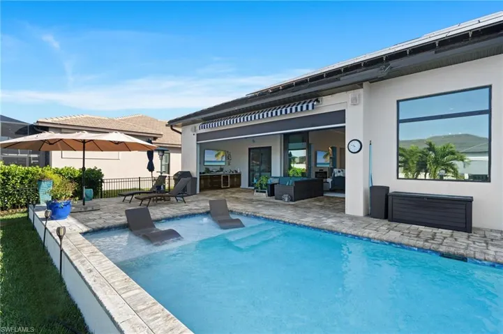 Back of property featuring an outdoor living space