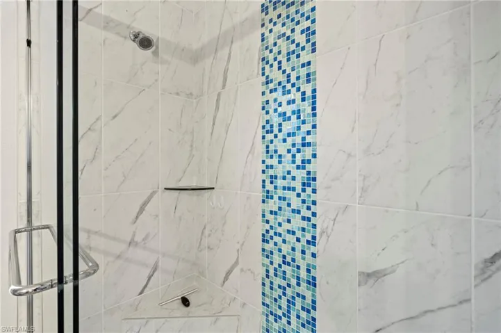 Bathroom with a shower with door