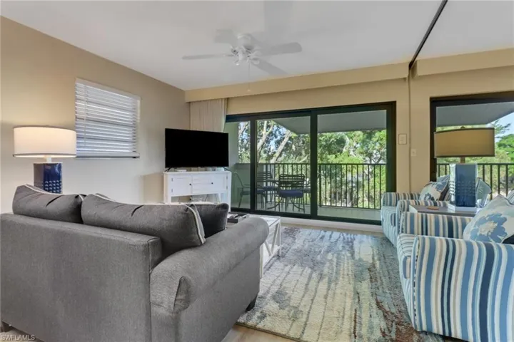 Living area featuring a ceiling fan and wood finished floors
