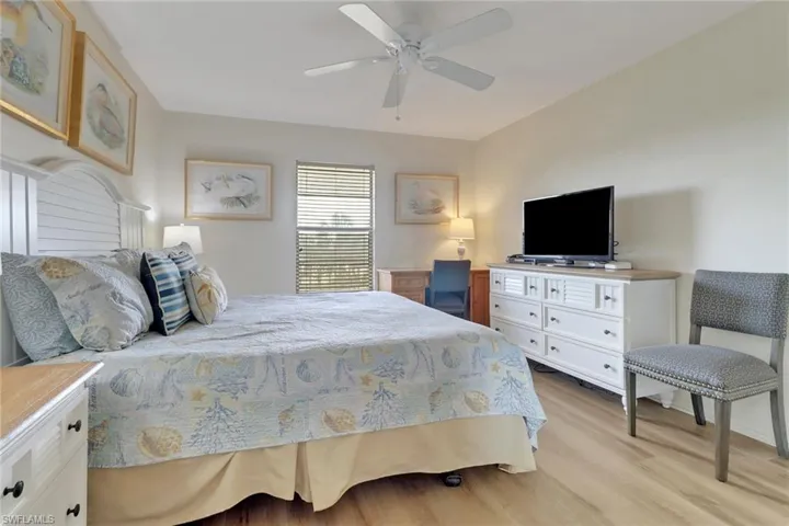 Bedroom featuring light wood-style flooring and a ceiling fan