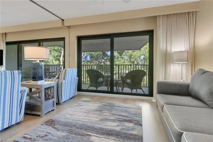 Doorway to outside featuring wood finished floors and ceiling fan