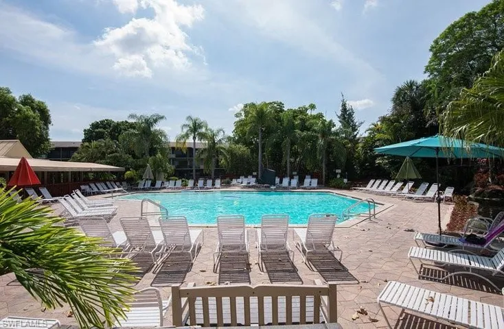 Community pool featuring a patio area