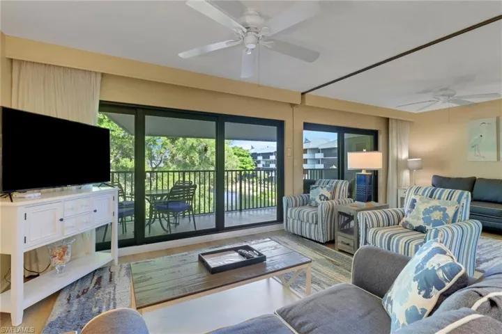 Living area featuring ceiling fan and wood finished floors